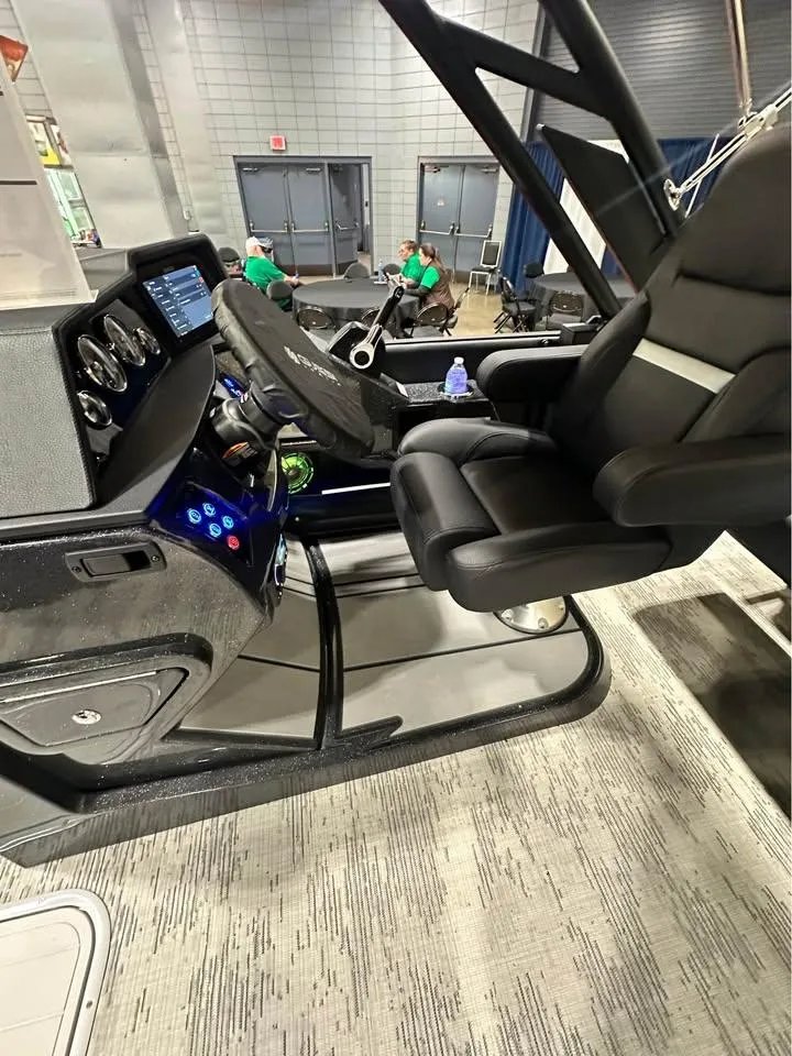 Slide: The Image of 2025 Crest Caribbean RS 230 boat interior with modern steering and comfortable seating. - 6