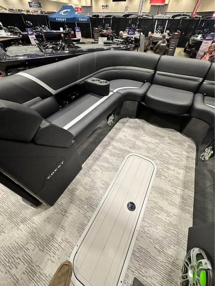 Slide: The Image of 2025 Crest Carribean RS 230 pontoon boat interior with sleek gray seating and modern design. - 7