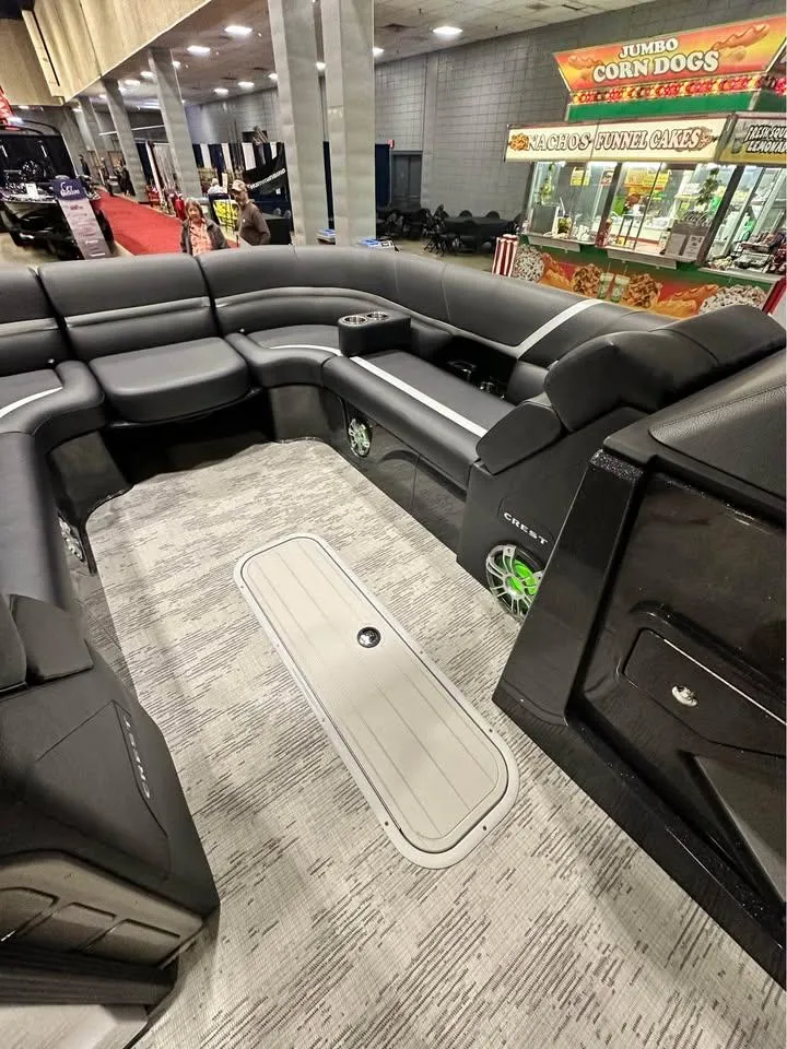Slide: The Image of 2025 Crest Carribean RS 230 boat interior with luxurious seating and modern design. - 8
