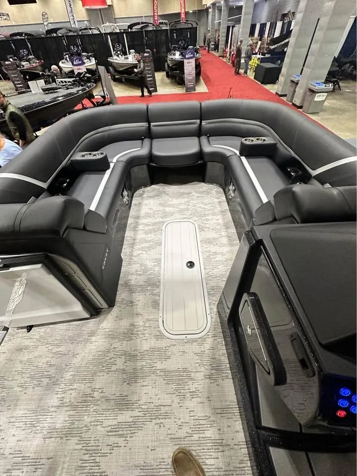 Slide: The Image of 2025 Crest Carribean RS 230 pontoon boat interior with luxurious seating and modern design. - 9