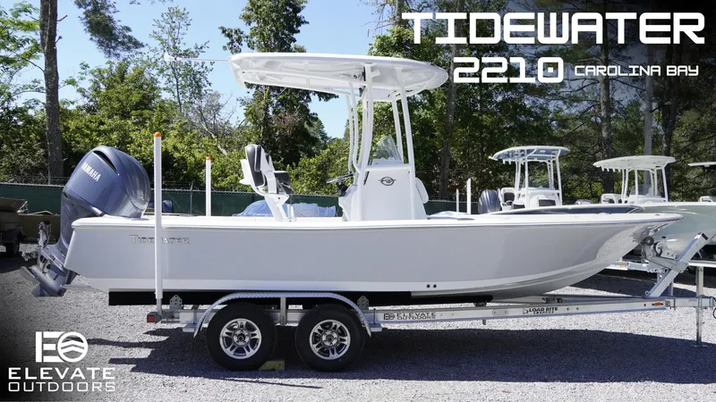 Slide: The Image of 2025 Tidewater 2210 Carolina Bay boat on trailer, displayed outdoors. - 0