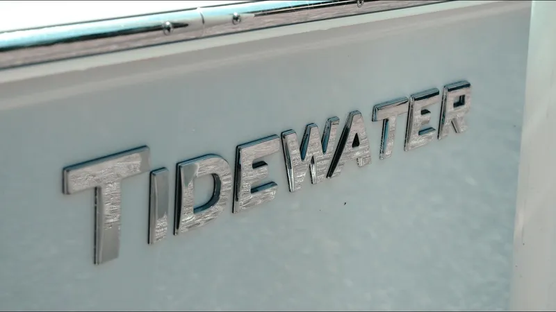 Slide: The Image of 2025 Tidewater 2210 Carolina Bay boat logo in metallic finish. - 10