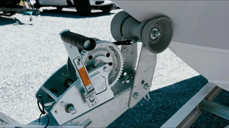 Slide: The Image of Trailer winch for 2025 Tidewater 2210 Carolina Bay boat on gravel surface. - 13