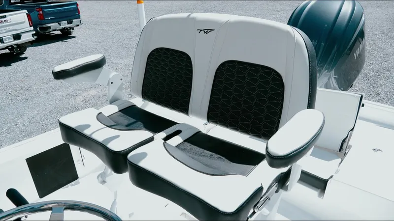 Slide: The Image of 2025 Tidewater 2210 Carolina Bay boat seats with black and white upholstery. - 17