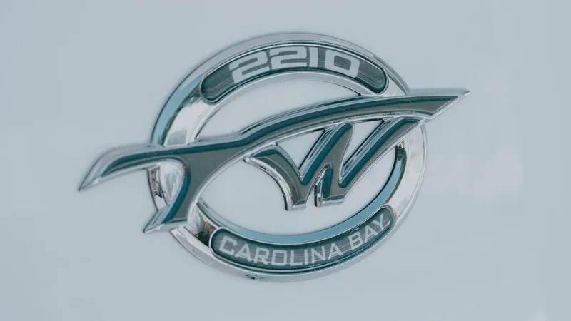 Slide: The Image of 2025 Tidewater 2210 Carolina Bay logo emblem on a boat. - 25