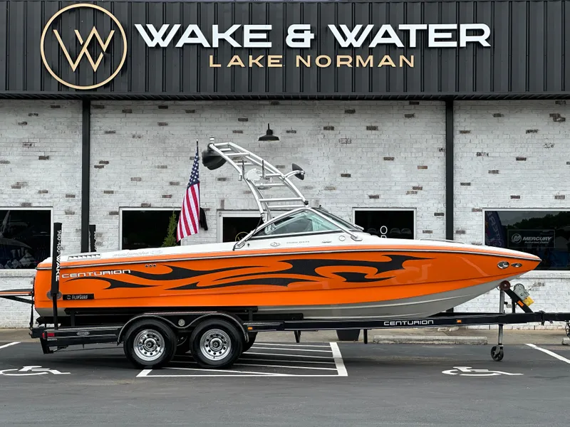 Slide: The Image of 2007 Centurion Avalanche boat with vibrant orange design at Wake & Water, Lake Norman. - 0