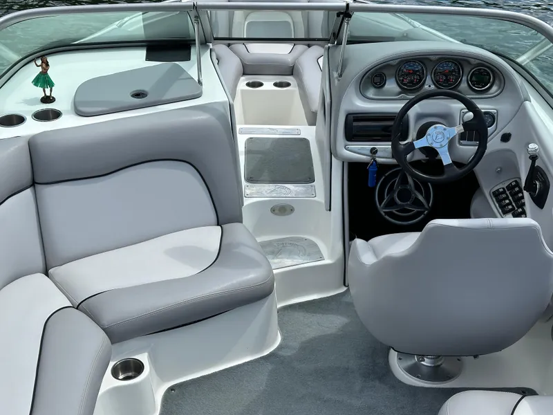 Slide: The Image of Interior of a 2007 Centurion Avalanche boat with gray seating and dashboard. - 11