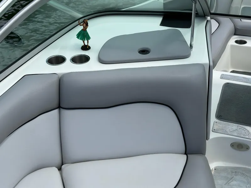 Slide: The Image of 2007 Centurion Avalanche boat interior with gray seating and cup holders. - 12