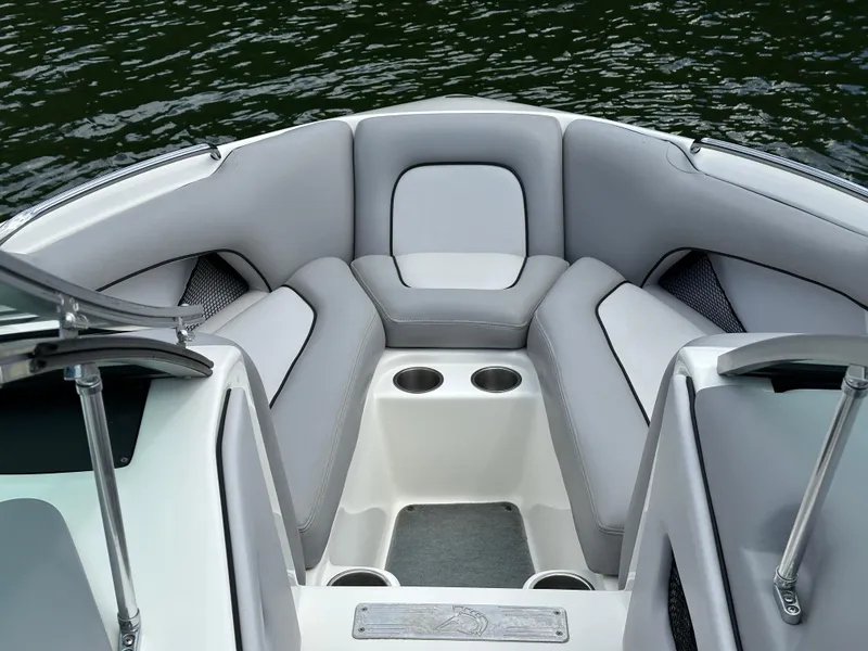 Slide: The Image of 2007 Centurion Avalanche boat interior with gray seating and cup holders. - 16