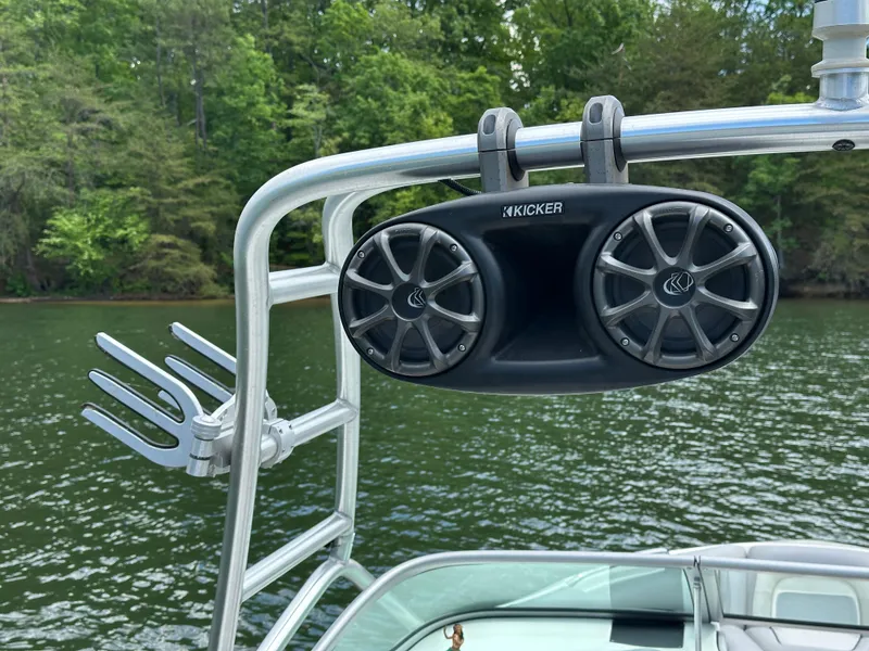 Slide: The Image of Wakeboard tower speakers on 2007 Centurion Avalanche boat, lake background, lush greenery. - 19