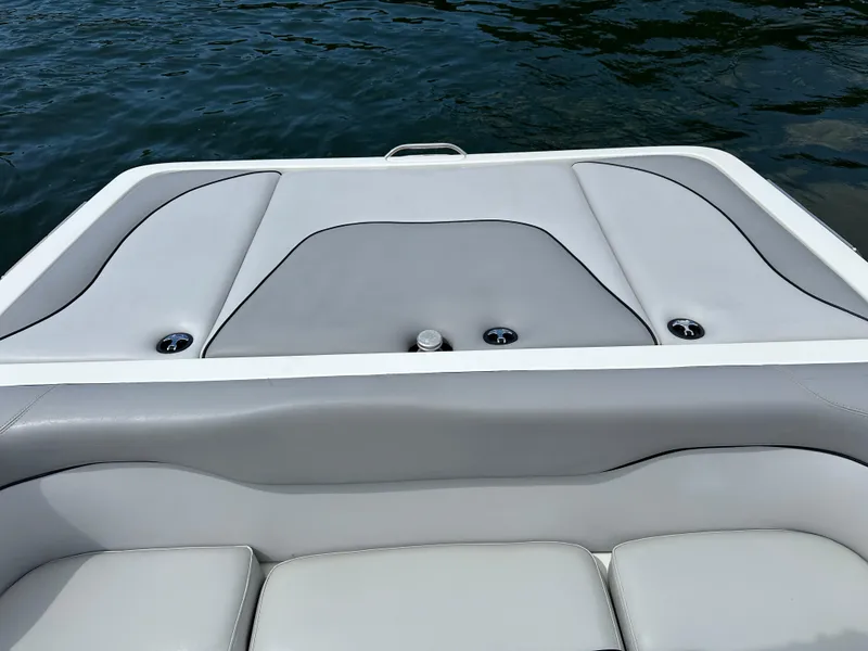 Slide: The Image of 2007 Centurion Avalanche boat interior with gray seating, on calm water. - 8
