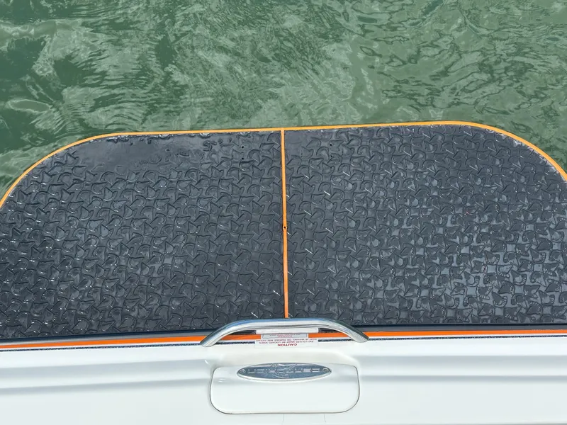 Slide: The Image of 2007 Centurion Avalanche boat swim platform with textured surface on water. - 9