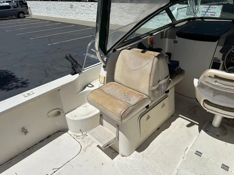 Slide: The Image of 2002 Trophy Walkaround boat interior with seating and steering area. - 12