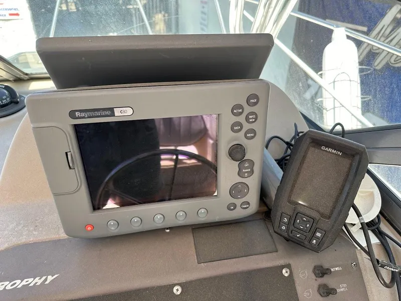 Slide: The Image of Boat dashboard with Raymarine and Garmin navigation devices, Trophy 2002 Walkaround model. - 21