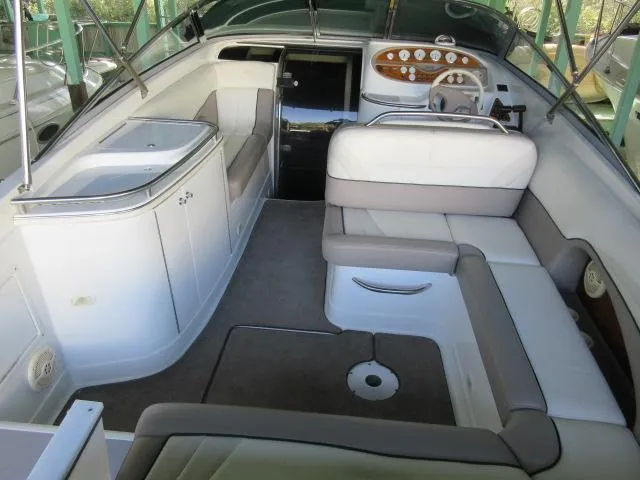 Slide: The Image of Interior of a 1998 Cobalt 293 boat with white and gray seating. - 14