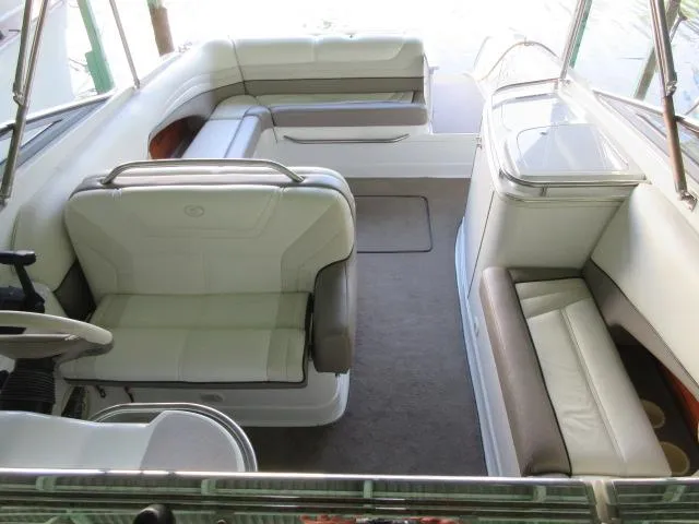 Slide: The Image of Interior of a 1998 Cobalt 293 boat with white seating and spacious layout. - 16