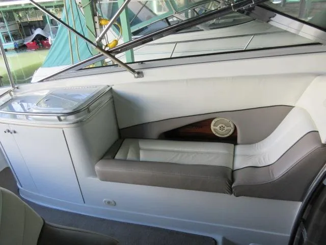 Slide: The Image of 1998 Cobalt 293 boat interior with seating and storage area. - 18