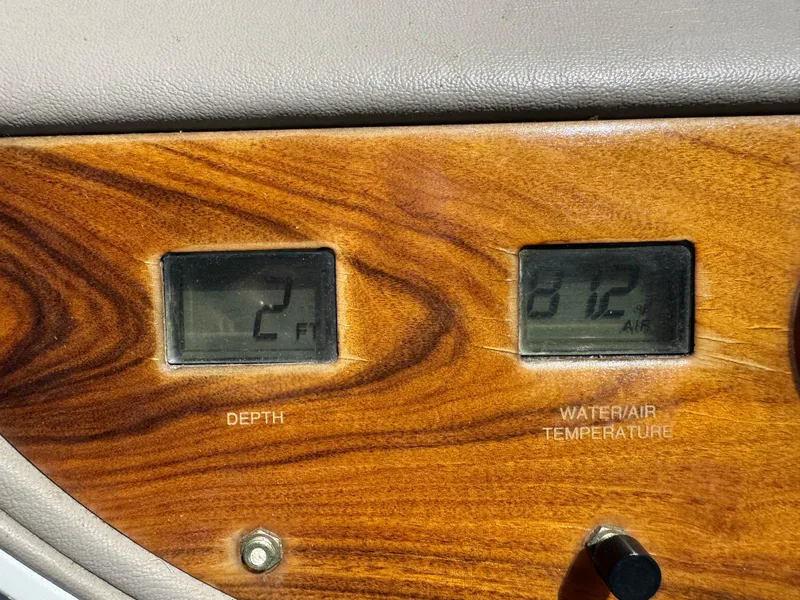 Slide: The Image of Dashboard of 1998 Cobalt 293 showing depth and water/air temperature gauges. - 31
