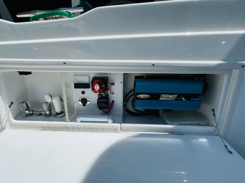 Slide: The Image of Electrical panel of a 1998 Cobalt 293 boat with inverter and controls. - 32