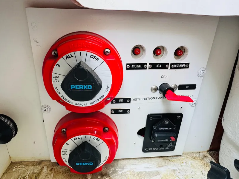 Slide: The Image of Control panel of a 1998 Cobalt 293 boat with Perko switches and distribution panel. - 33