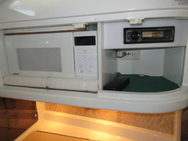 Slide: The Image of 1998 Cobalt 293 interior with microwave and stereo system. - 40