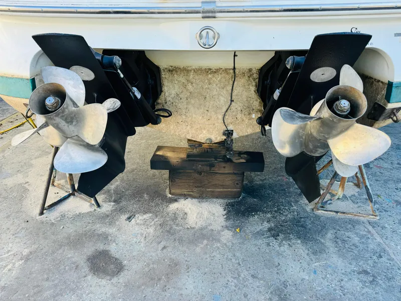 Slide: The Image of 1998 Cobalt 293 boat with dual propellers on a concrete surface. - 44