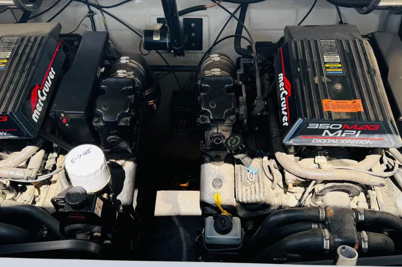 Slide: The Image of Twin MerCruiser 350 MAG MPI engines in a 1998 Cobalt 293 boat. - 47