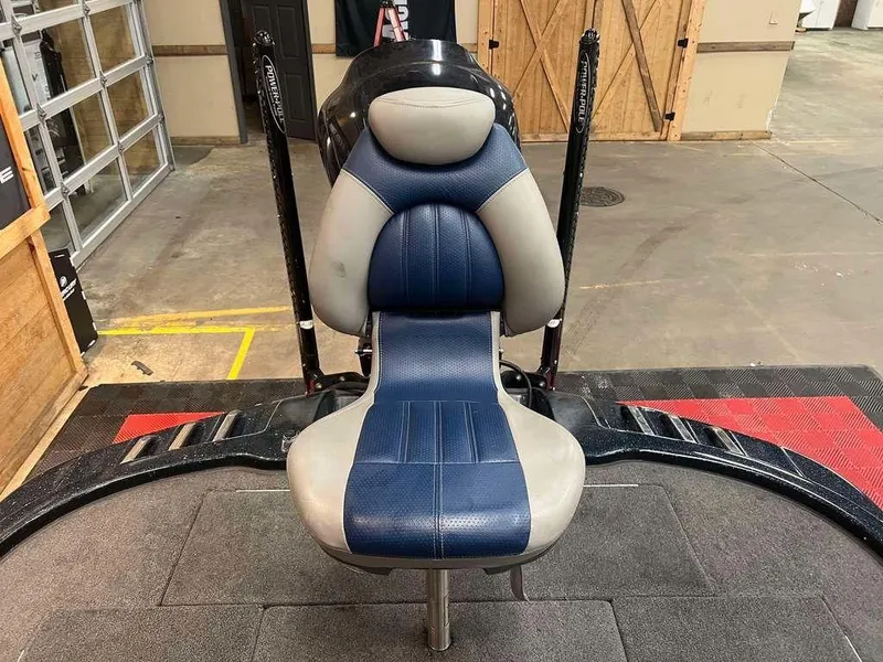 Slide: The Image of 2010 Ranger Z520 boat seat in a garage setting. - 8