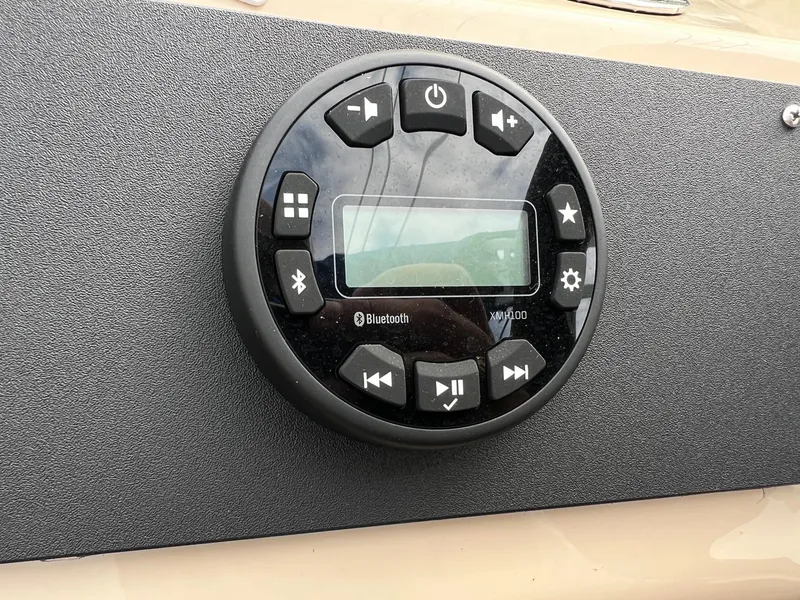 Slide: The Image of Control panel of a 2017 Sun Tracker Fishin' Barge 22 DLX with Bluetooth functionality. - 21