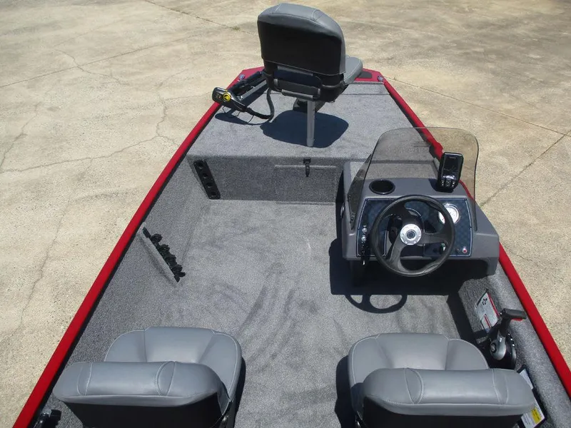 Slide: The Image of 2025 Tracker BASS TRACKER® Classic XL boat interior with steering console and seating. - 5