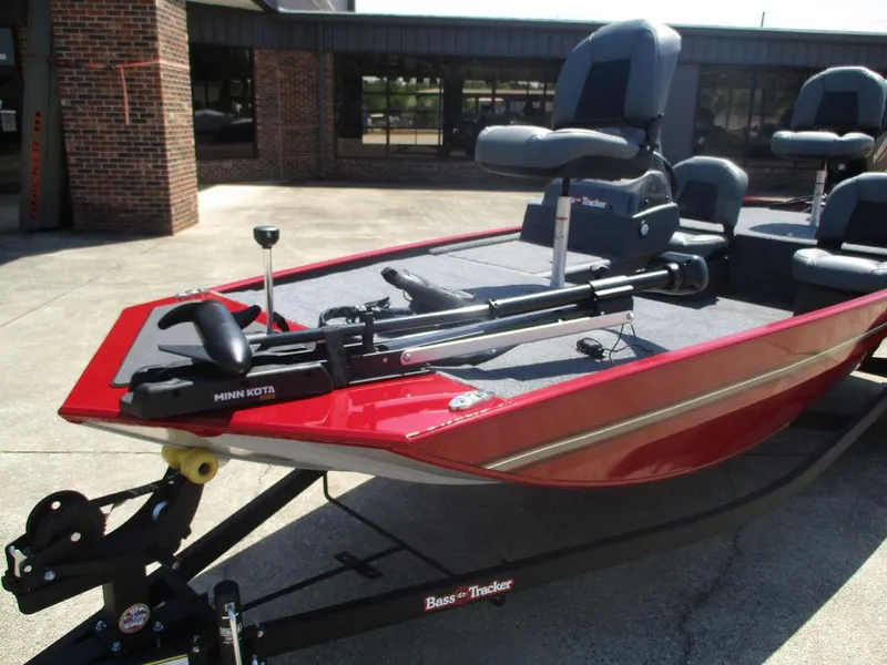 Slide: The Image of 2025 Tracker BASS TRACKER® Classic XL boat with Minn Kota motor, red exterior. - 7