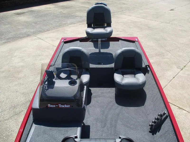 Slide: The Image of 2025 Tracker BASS TRACKER® Classic XL boat interior with seating and steering console. - 8