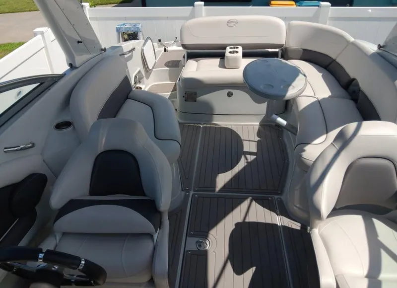 Slide: The Image of 2017 Crownline 275 SS boat interior with plush seating and table. - 3