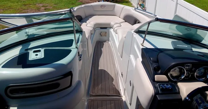 Slide: The Image of 2017 Crownline 275 SS boat interior with seating and dashboard view. - 4