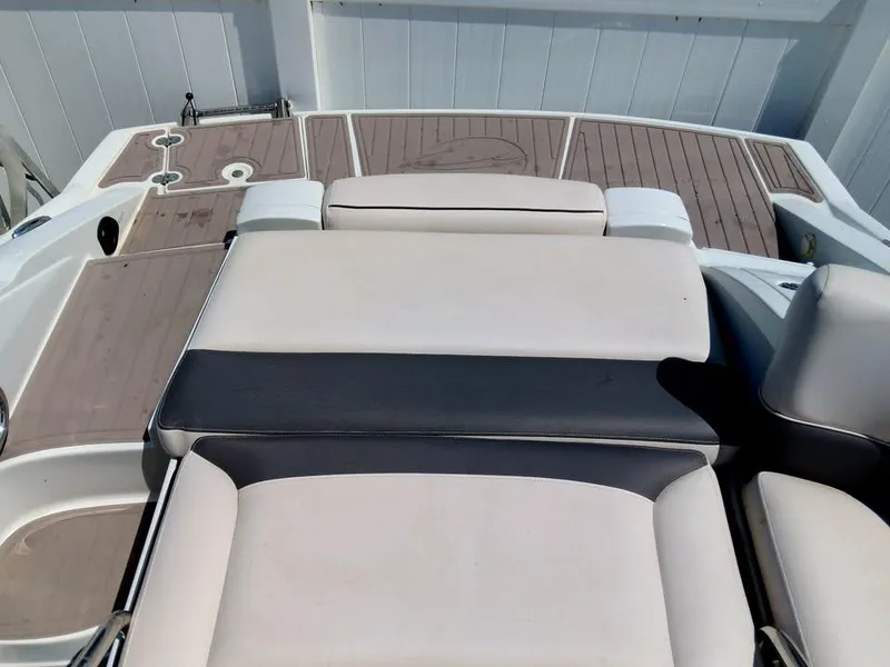 Slide: The Image of 2017 Crownline 275 SS boat interior with cushioned seating and teak flooring. - 5