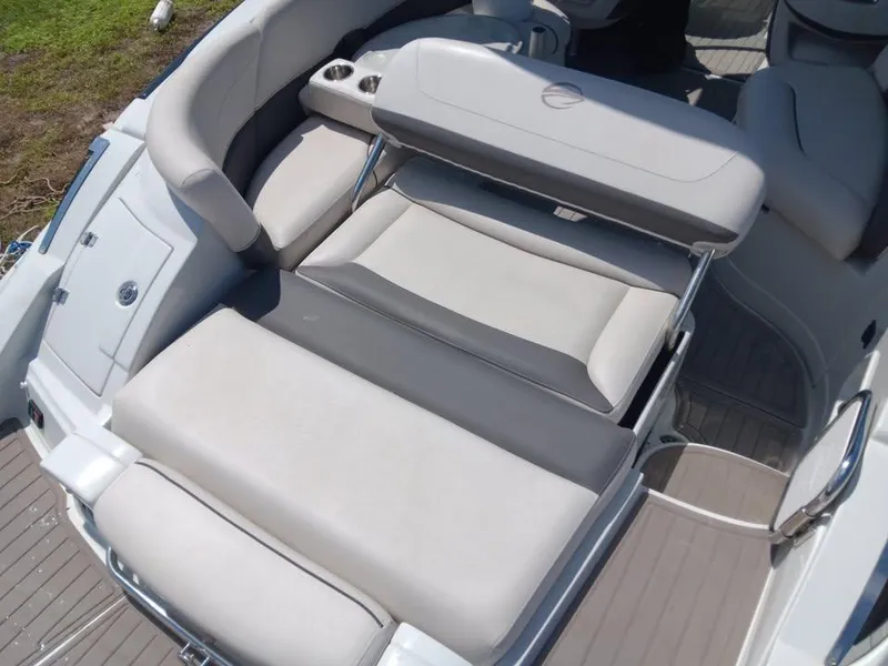 Slide: The Image of 2017 Crownline 275 SS boat interior with adjustable seating and cup holders. - 6