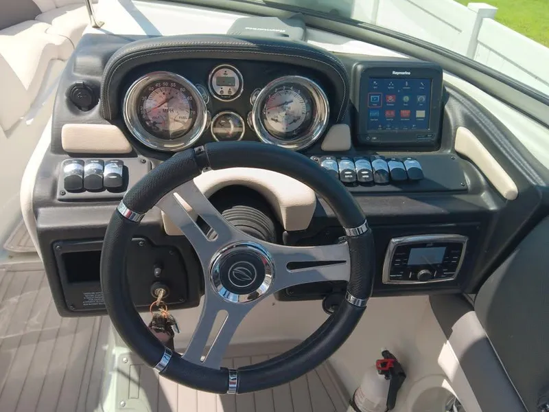 Slide: The Image of Steering console of a 2017 Crownline 275 SS boat with gauges and navigation system. - 7