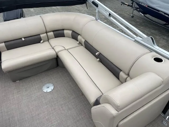 Slide: The Image of 2022 Sun Tracker Party Barge 20 DLX pontoon boat with beige seating and cup holder. - 12