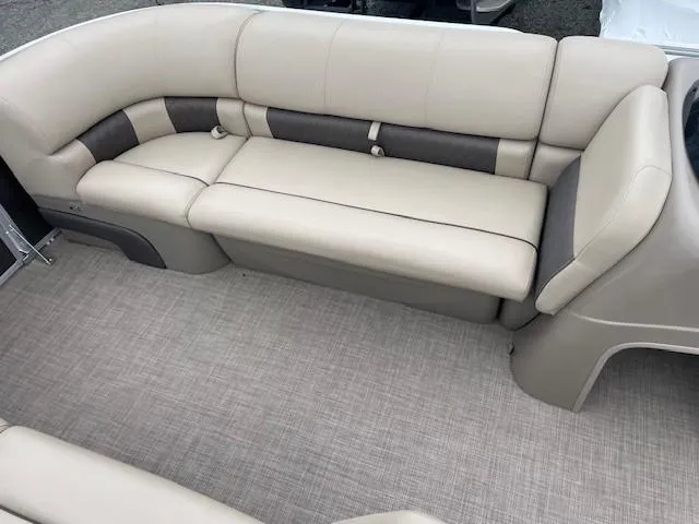 Slide: The Image of 2022 Sun Tracker Party Barge 20 DLX interior seating with beige upholstery. - 16