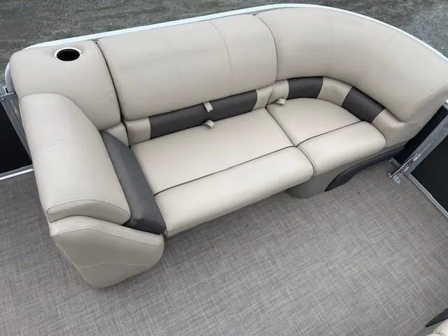 Slide: The Image of 2022 Sun Tracker Party Barge 20 DLX seating with beige and gray upholstery. - 17