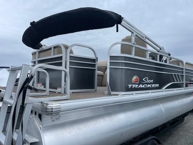 Slide: The Image of 2022 Sun Tracker Party Barge 20 DLX pontoon boat with canopy, silver exterior. - 2