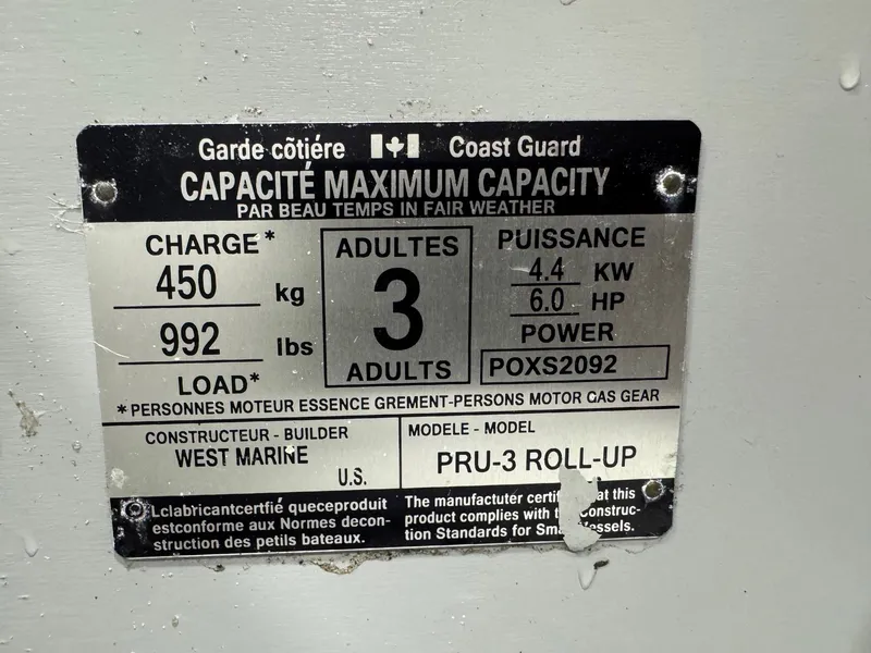 Slide: The Image of Capacity label for West Marine PRU-3 Roll-Up, max 3 adults, 992 lbs, 6 HP, 2004 Pursuit 2470 CC. - 35