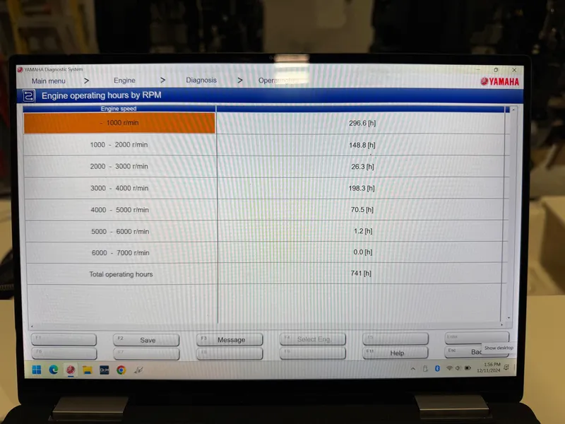 Slide: The Image of Laptop displaying Yamaha engine operating hours by RPM for Pursuit 2470 CC, 2004 model. - 39