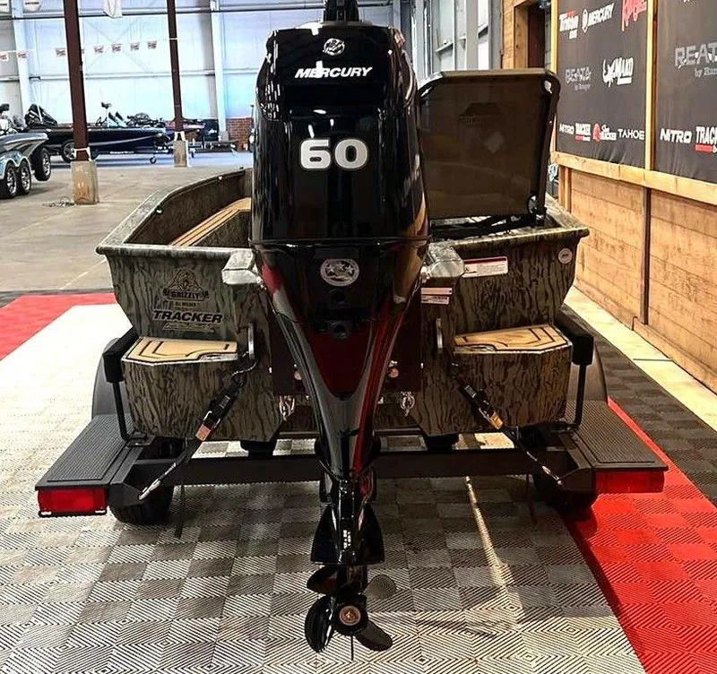 Slide: The Image of 2025 Tracker Grizzly® 1650 T Prairie Wings Edition boat with Mercury 60 engine in showroom. - 3