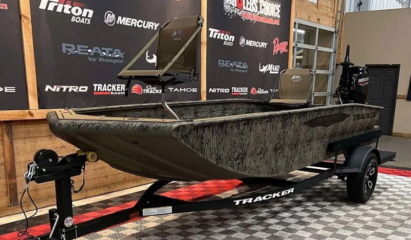 Slide: The Image of 2025 Tracker Grizzly® 1650 T Prairie Wings Edition boat on display in showroom. - 4