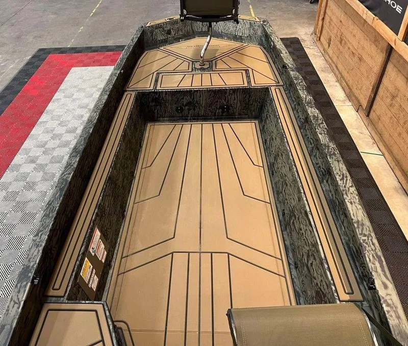 Slide: The Image of 2025 Tracker Grizzly® 1650 T Prairie Wings Edition boat interior with camo design and seating. - 5