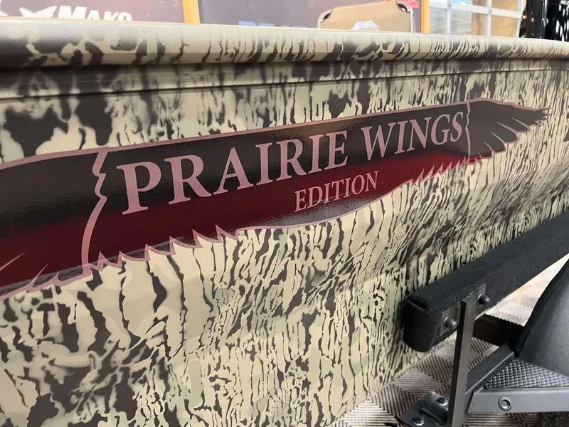 Slide: The Image of 2025 Tracker Grizzly® 1650 T Prairie Wings Edition with camouflage design and logo detail. - 9