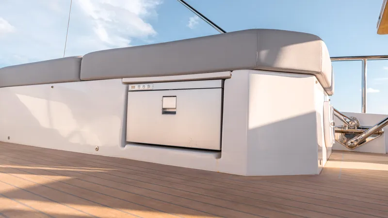 Slide: The Image of 2024 Pardo Yachts E60 deck with cushioned seating and storage compartment. - 30