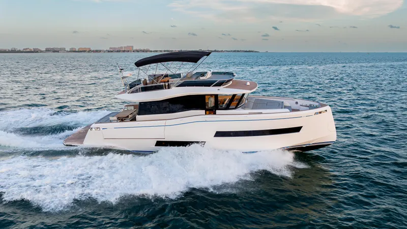 Slide: The Image of 2024 Pardo Yachts E60 cruising on open water, showcasing sleek design and luxury features. - 4