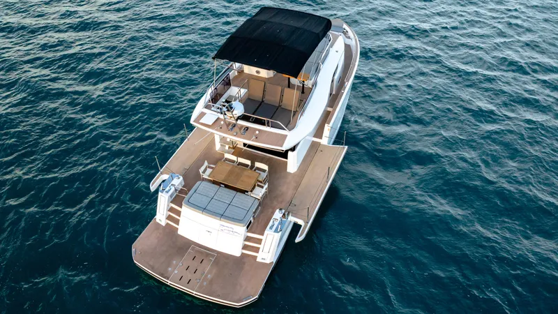 Slide: The Image of 2024 Pardo Yachts E60 luxury yacht on open water, aerial view. - 12